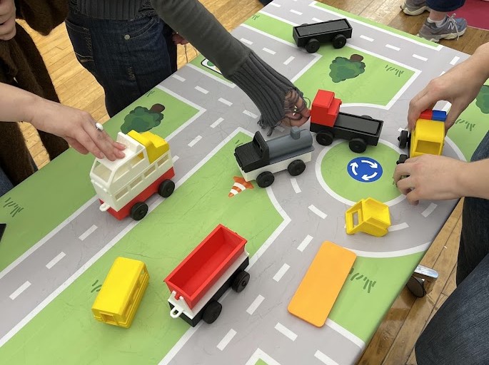 image of display of new vehicle designs being played with